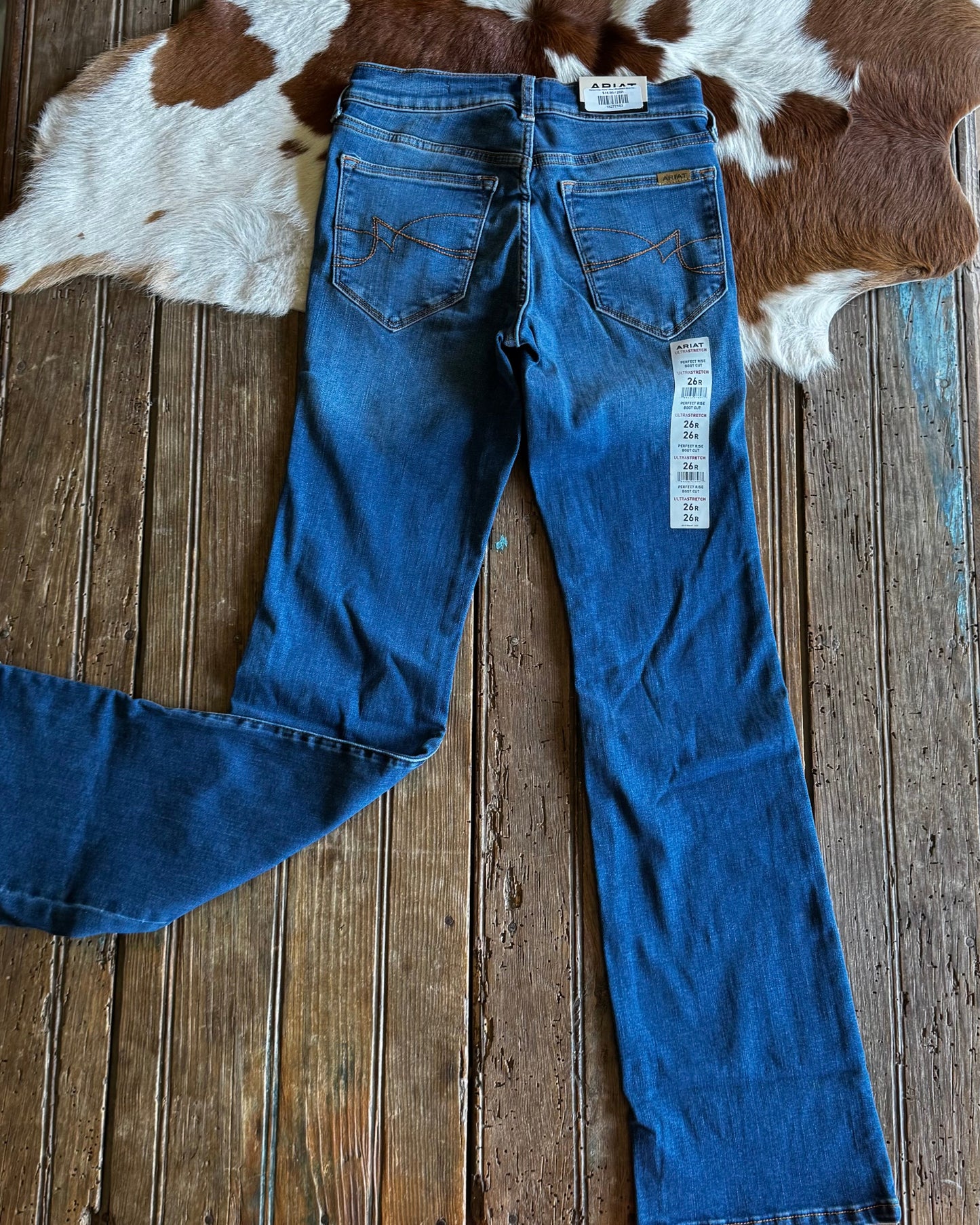 back side of jeans on a wooden surface