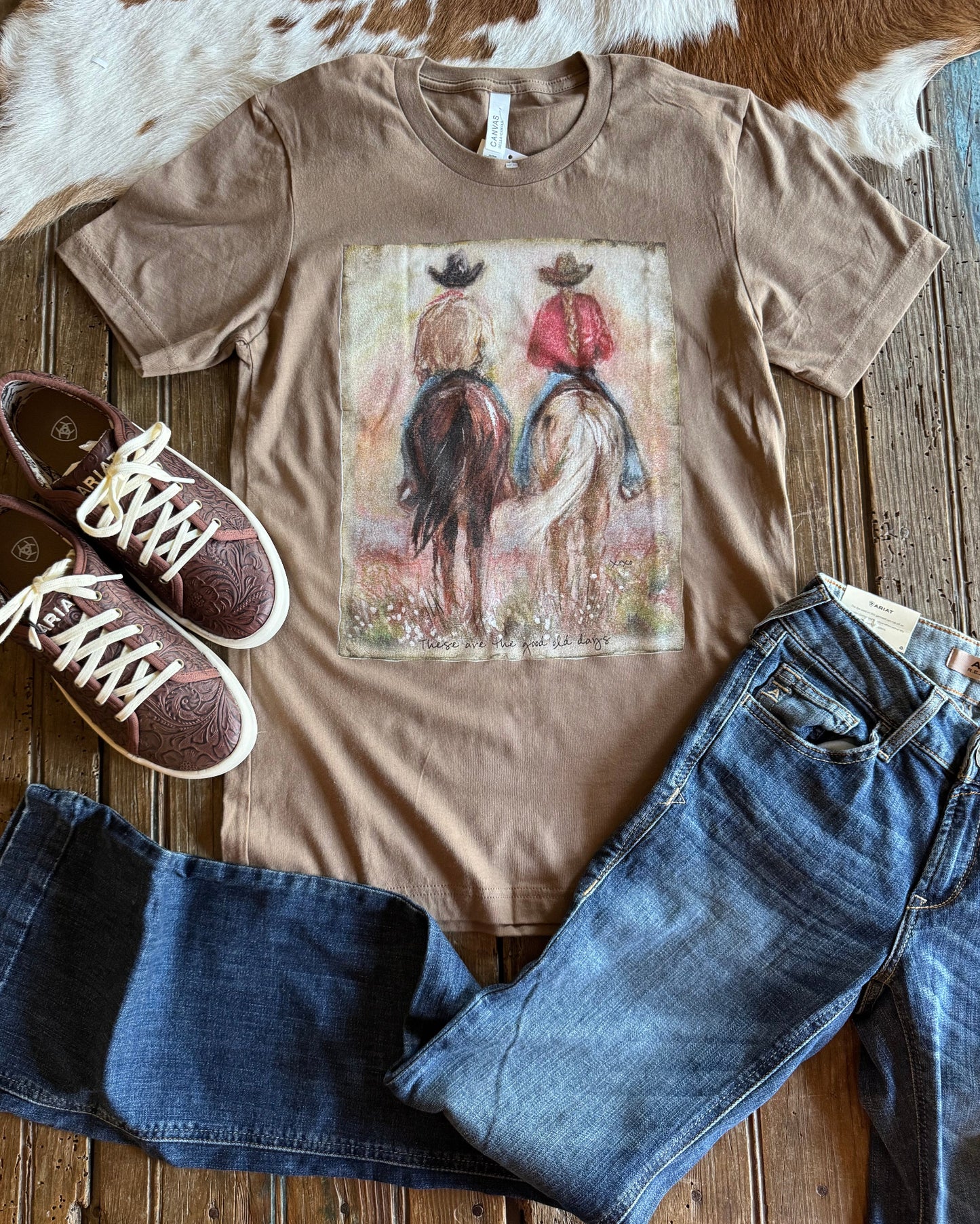 Good ol Days graphic tee with jeans and shoes on rustic wood background