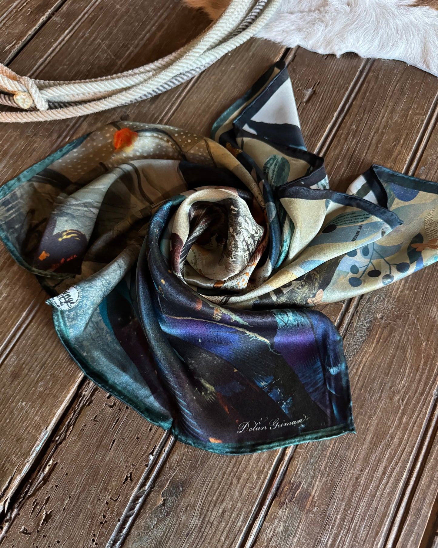 Folded scarf with a pattern on a wooden surface
