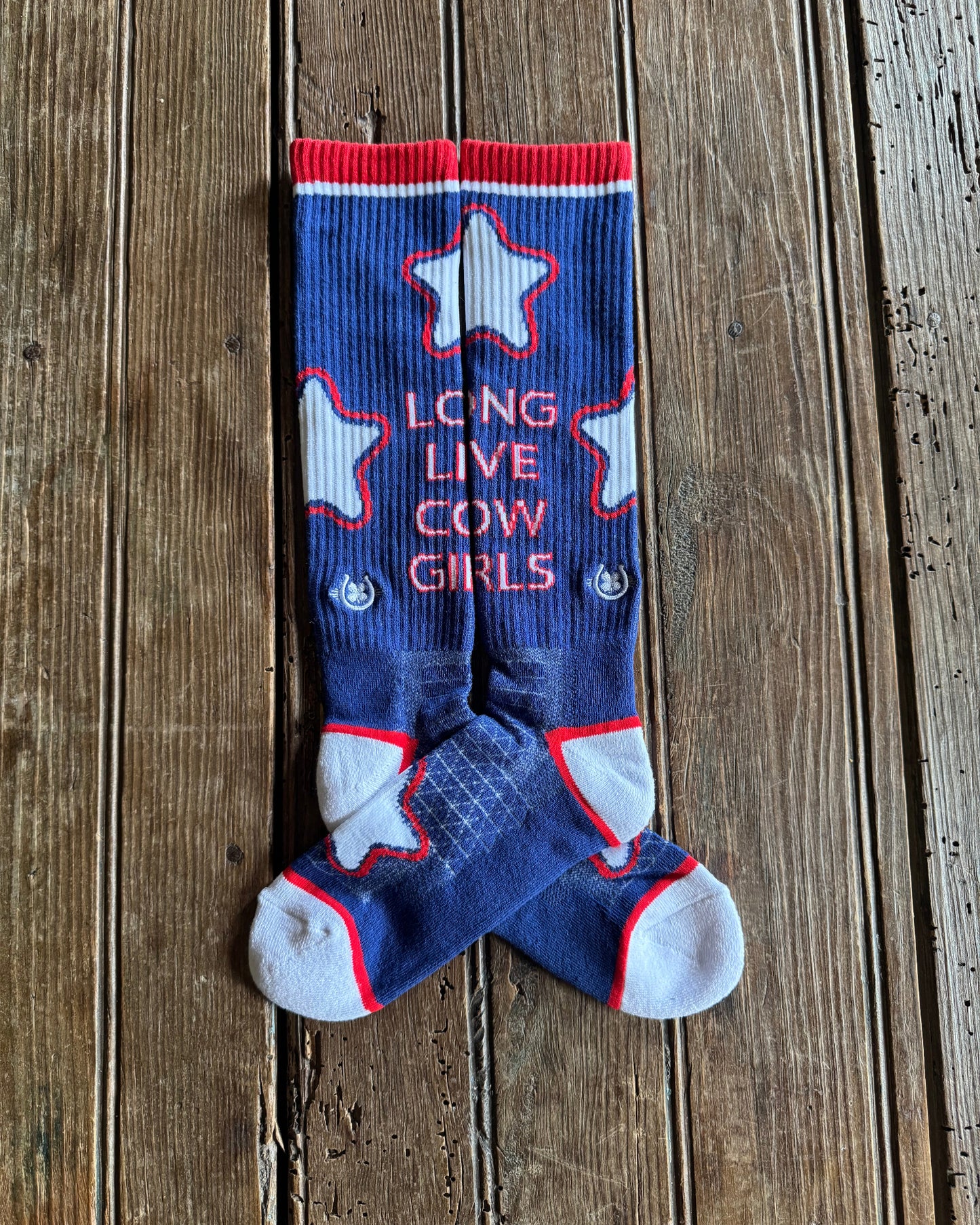 Long Live Cowgirls Performance Socks (Red/Blue) on rustic wood background