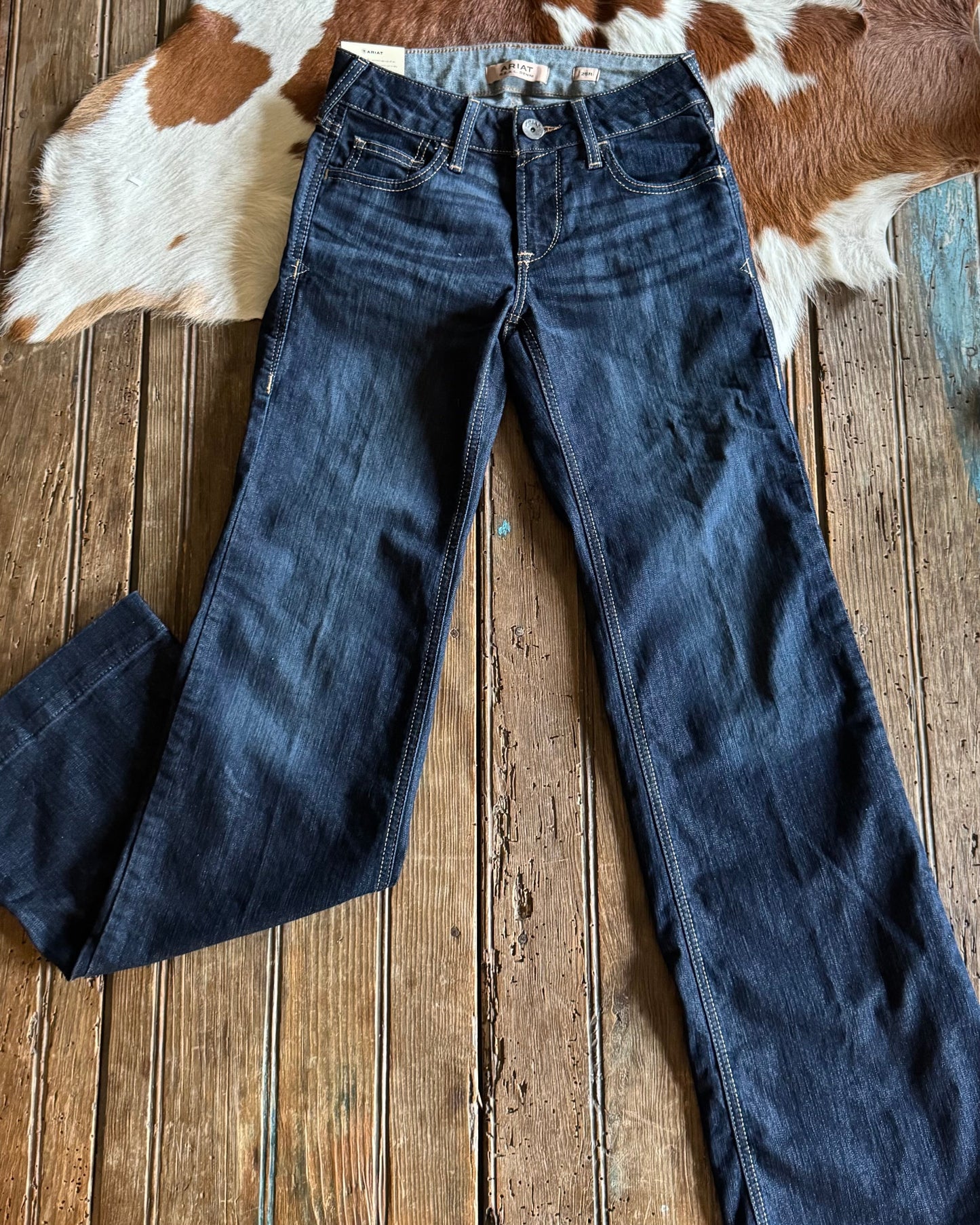 front view of Ophelia Perfect Rise Trouser Jeans on rustic wood background