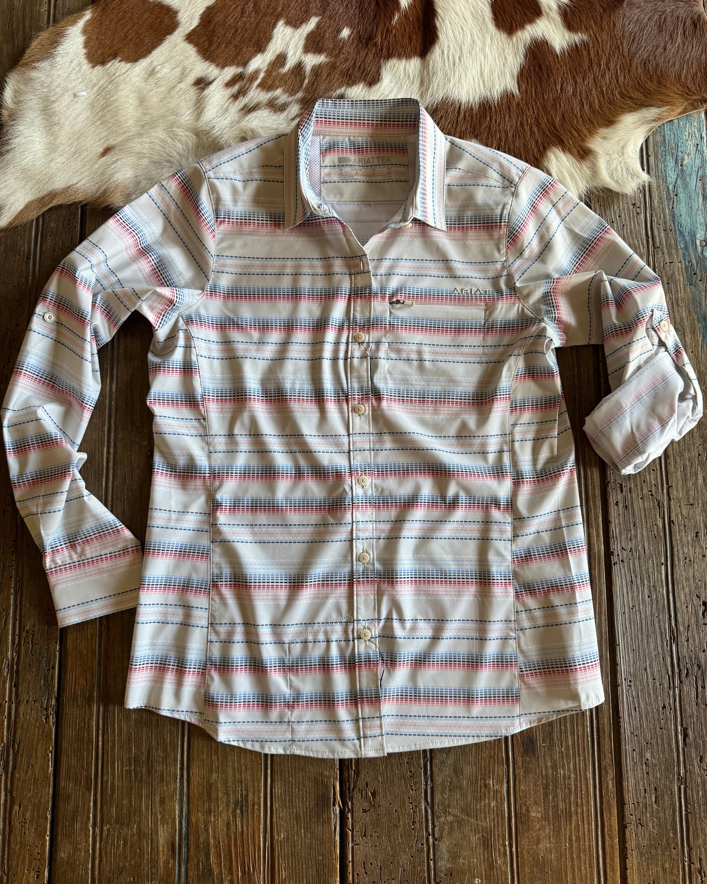 Stitch stripe button up shirt on rustic wood background