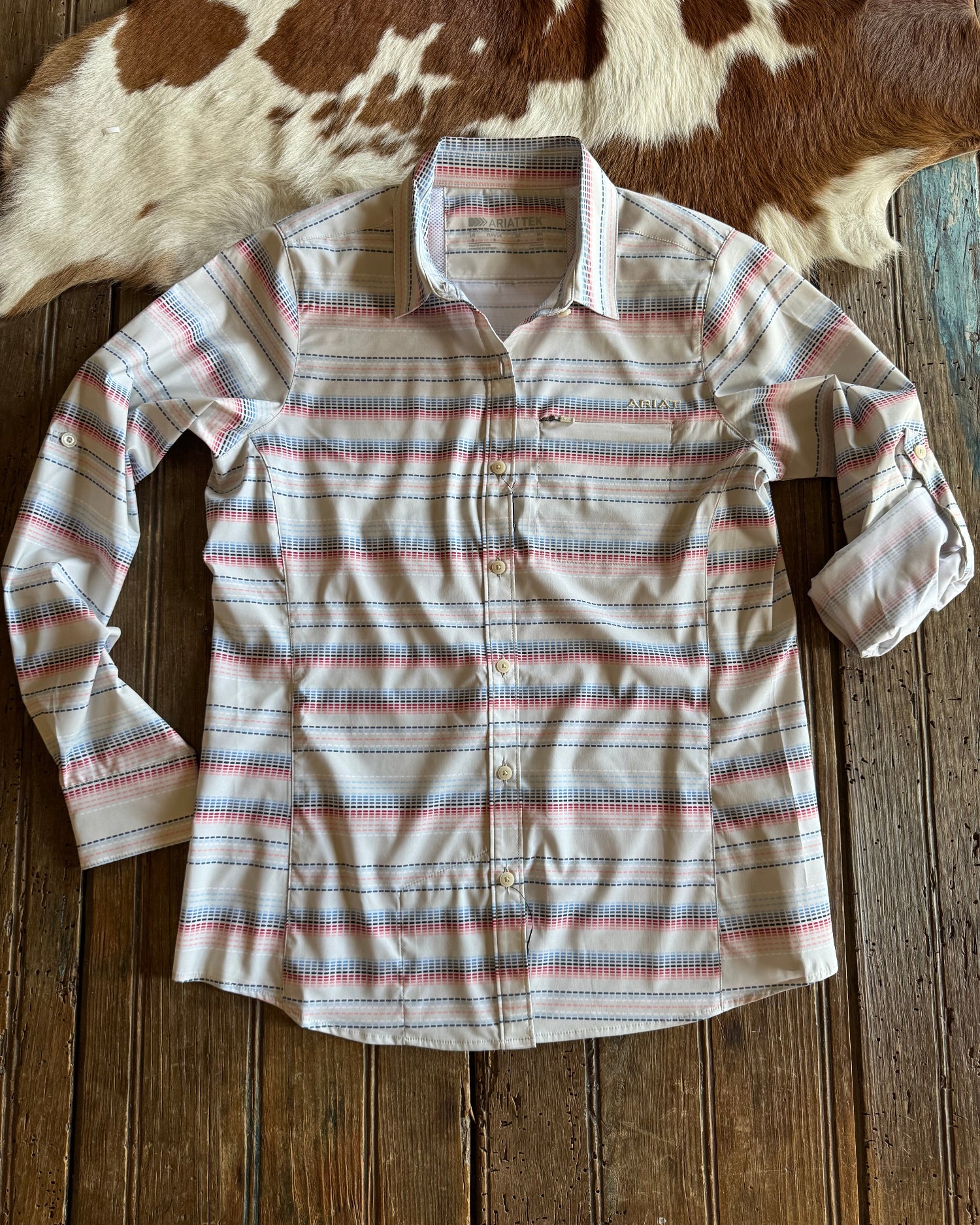 Stitch stripe button up shirt on rustic wood background