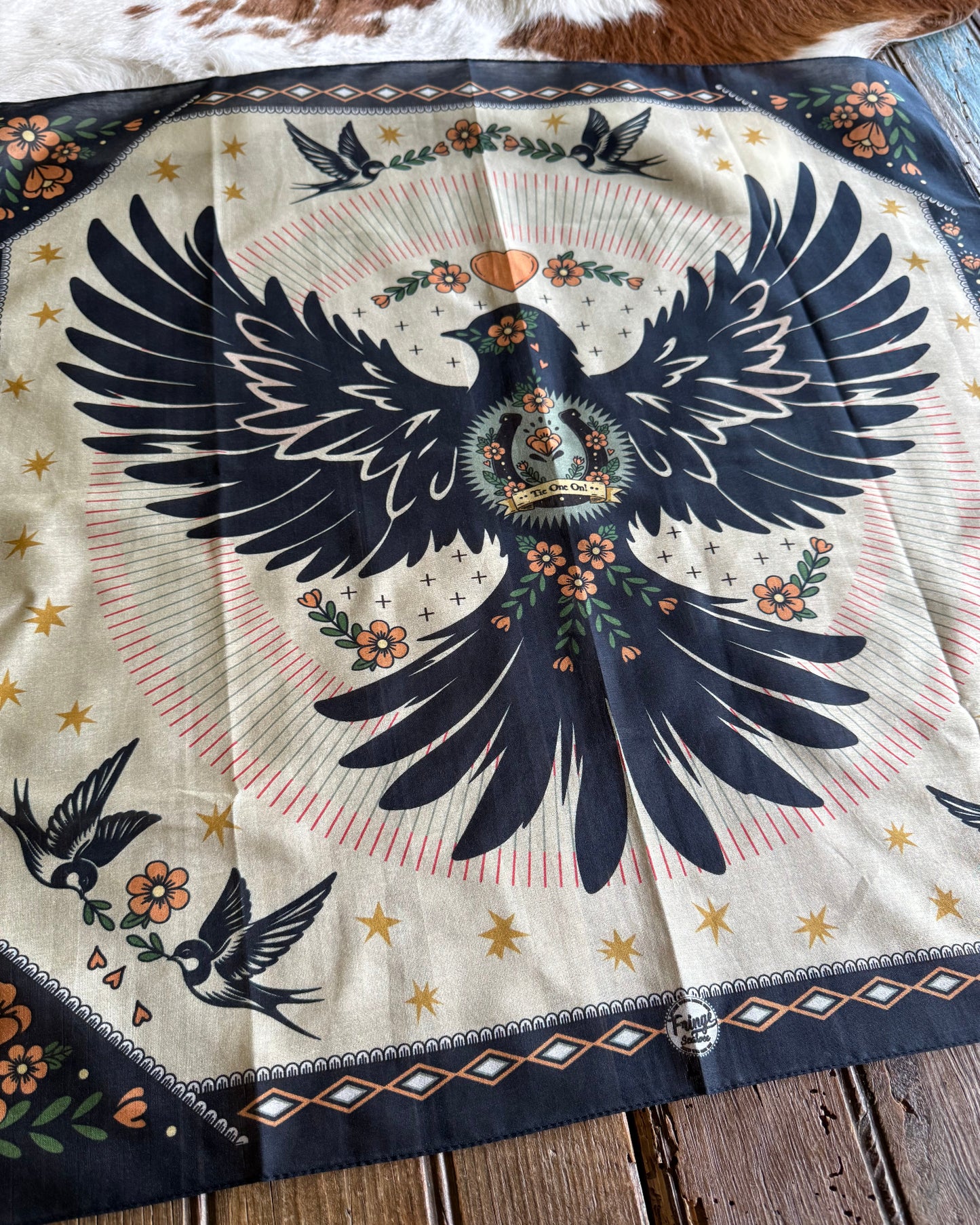 Decorative fabric with a dove design on a wooden surface