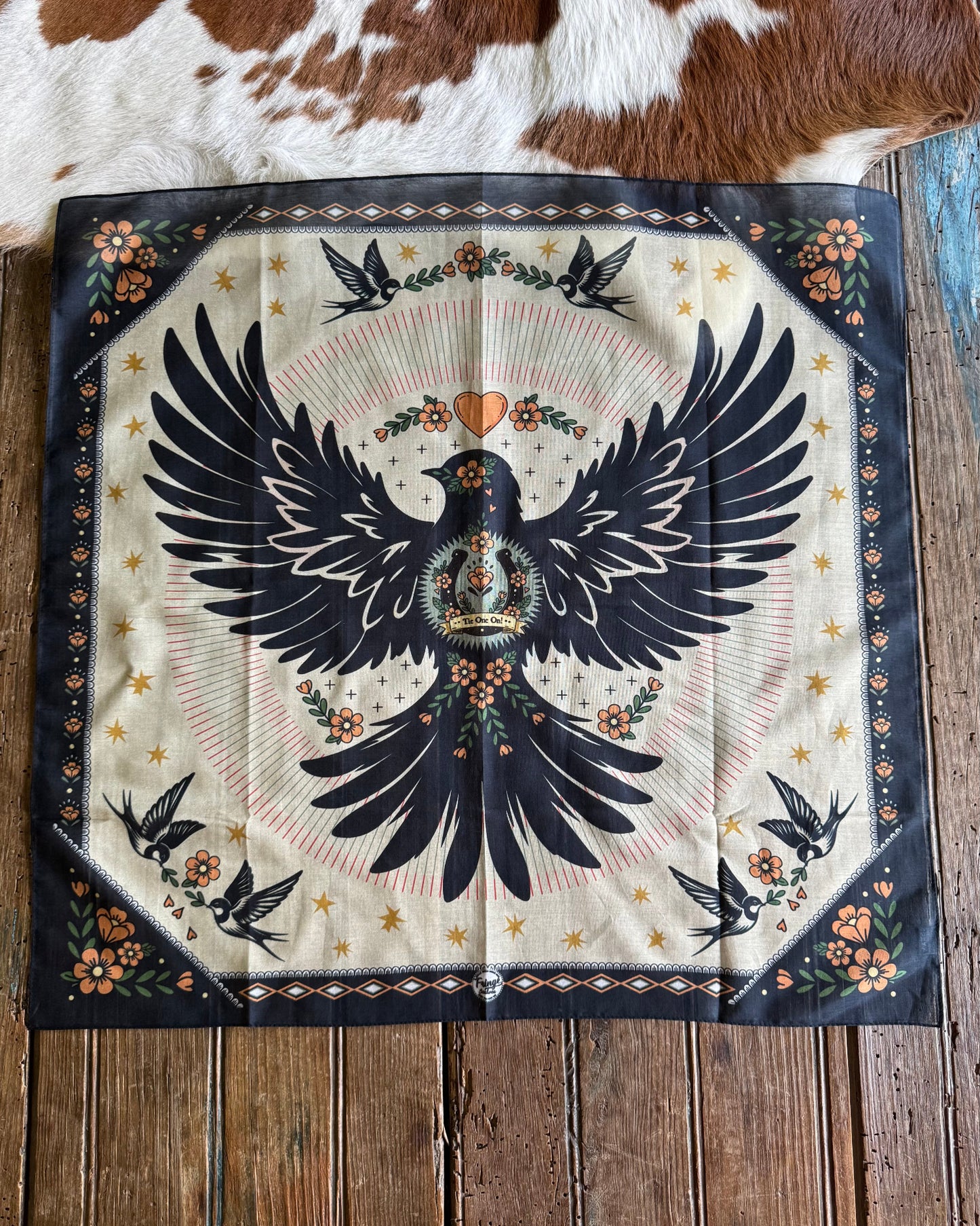 Bandana with an dove design on a wooden surface