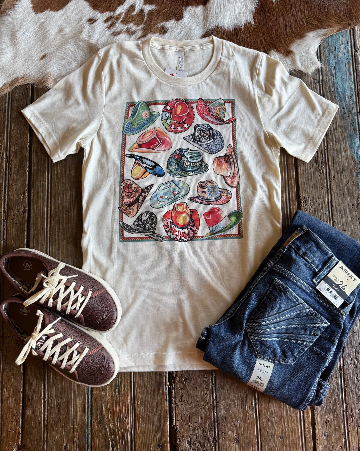 10 Gallon Hat Tee with jeans and shoes on rustic wood background