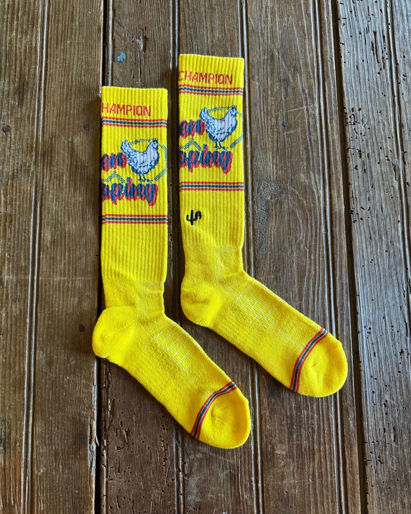 Cactus Alley Chicken Roping Performance Socks in yellow on rustic wood background