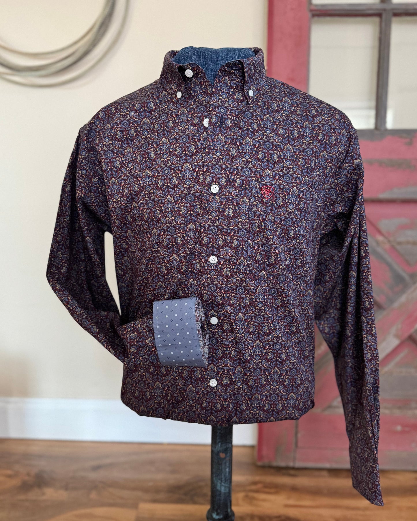 men's patterned shirt on mannequin with rustic background