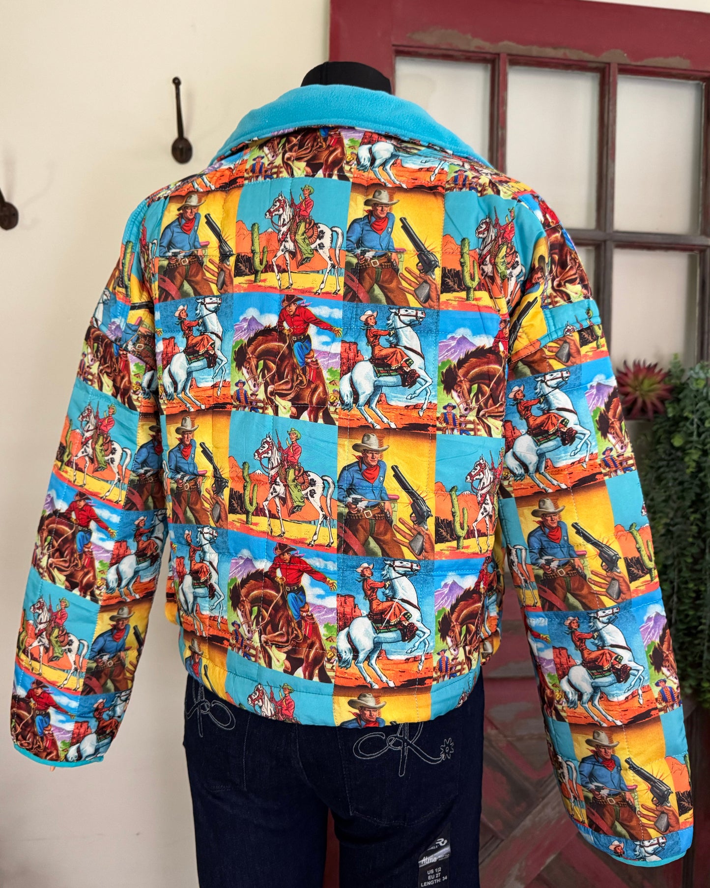 Colorful patterned coat on a mannequin with a neutral background