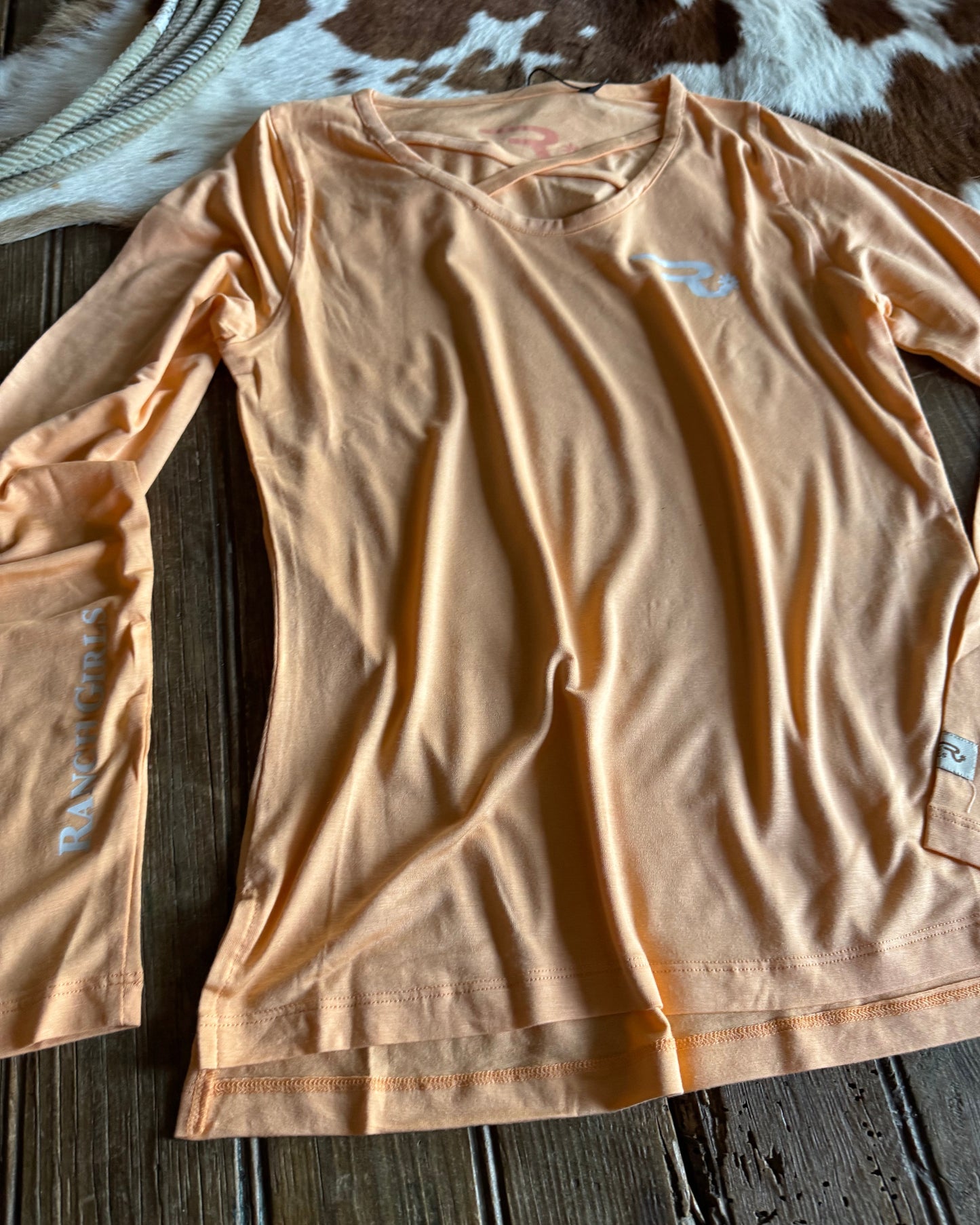 Beige shirt on a wooden surface