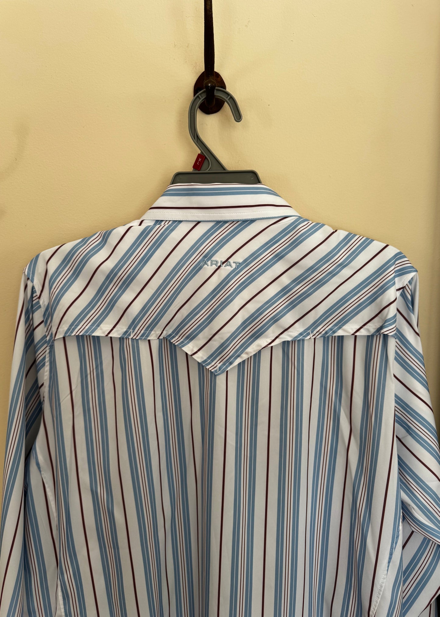 Striped fabric with a pocket on a beige background