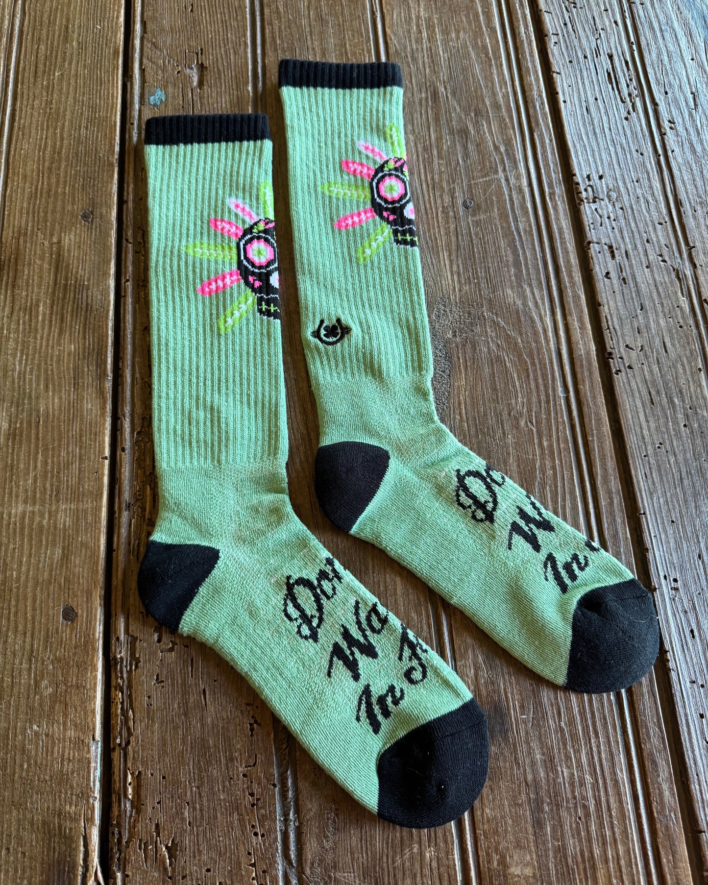 Don't Walk In Fear Performance Socks (Sage) on rustic wood background