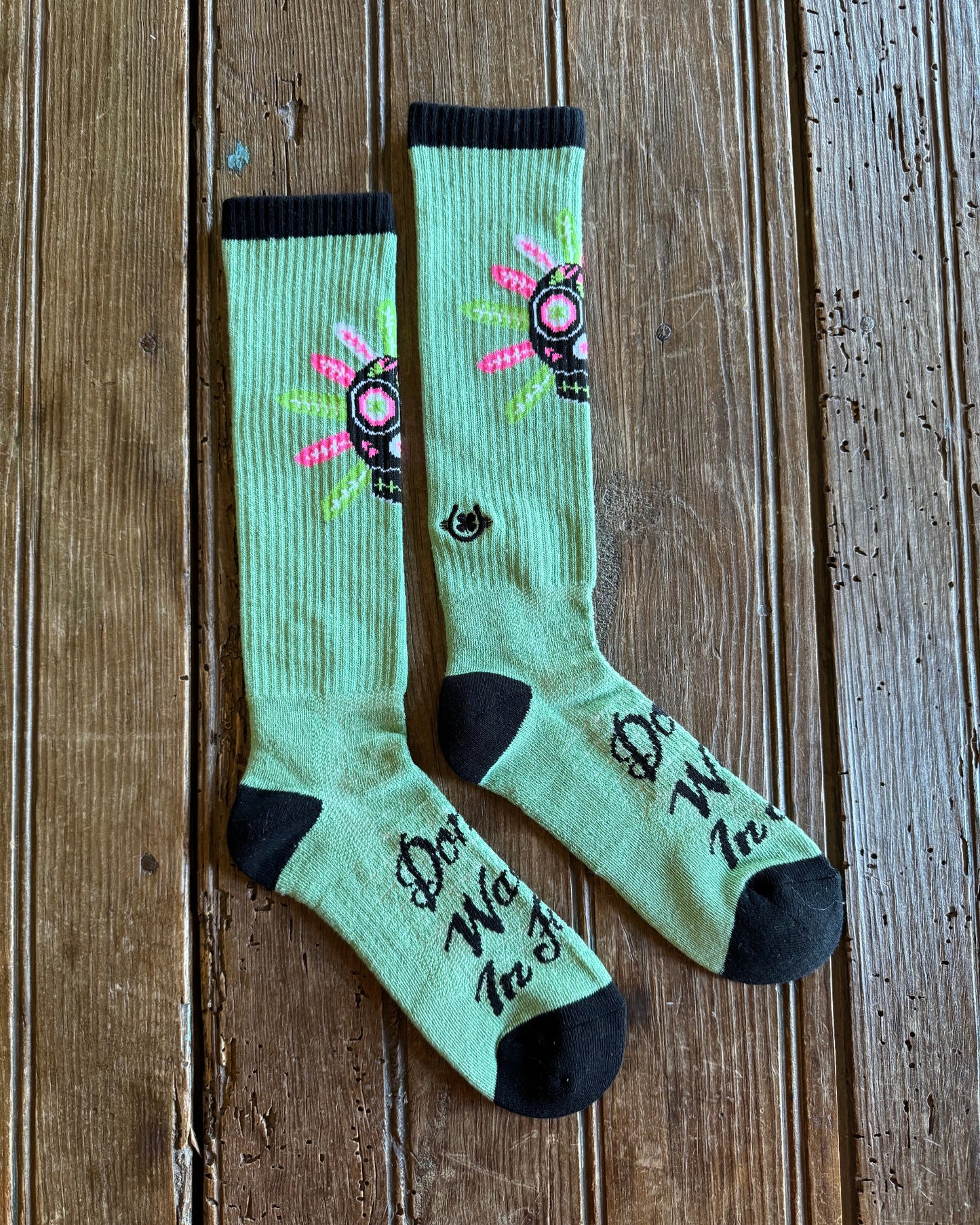 Don't Walk In Fear Performance Socks on rustic wood background