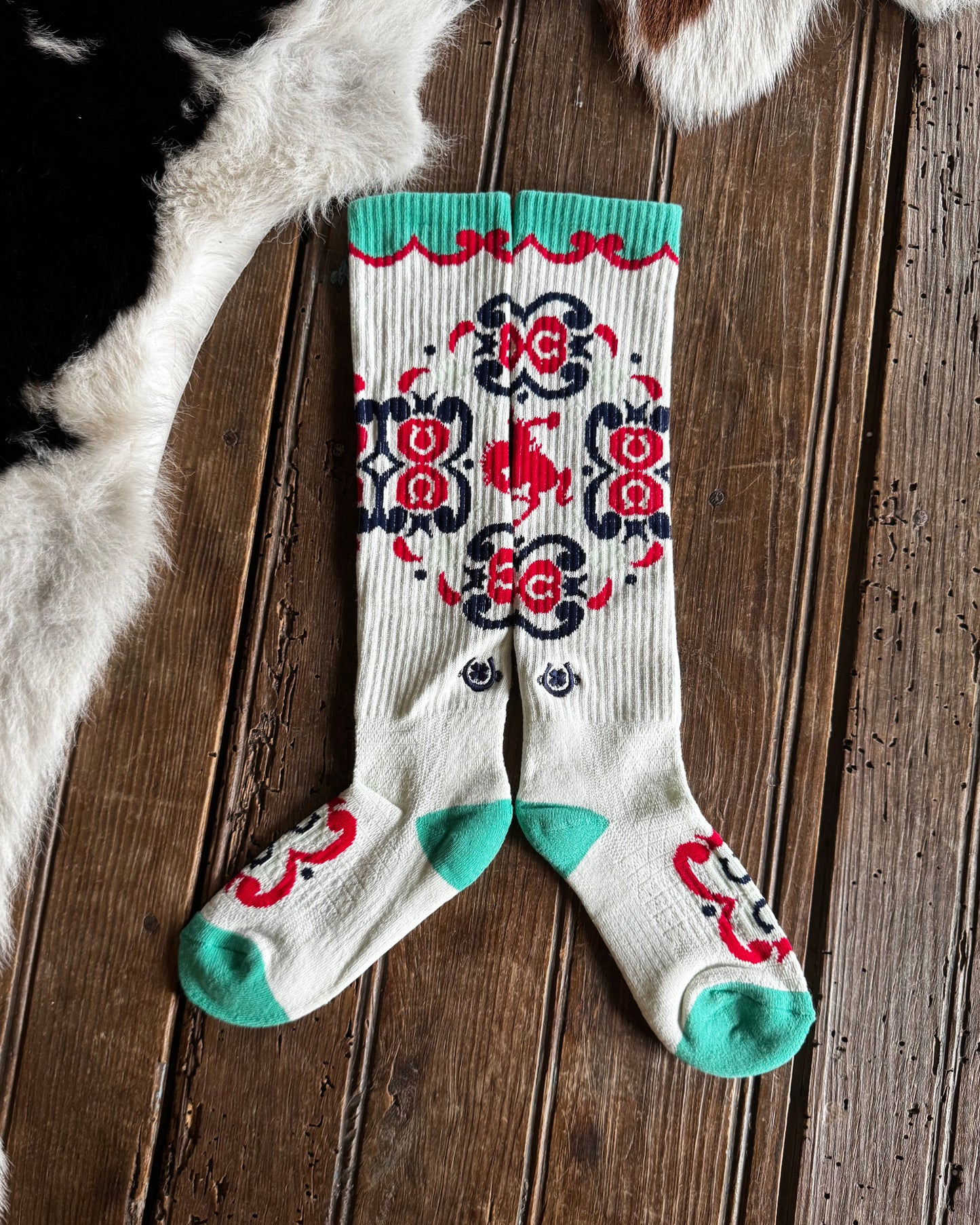 Decorative sock with floral pattern on a wooden surface