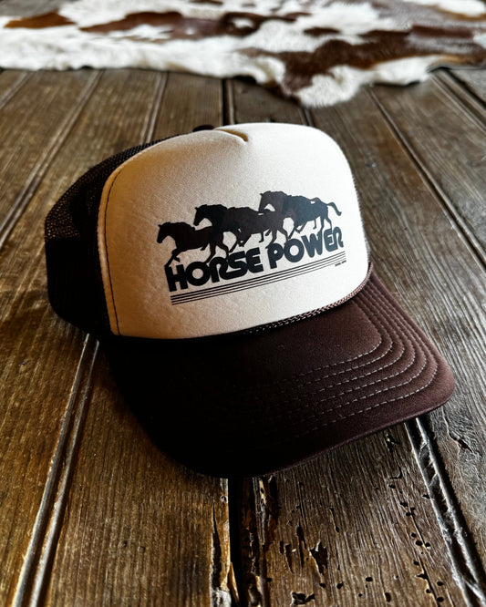 Cap with 'Horse Power' logo on a wooden surface