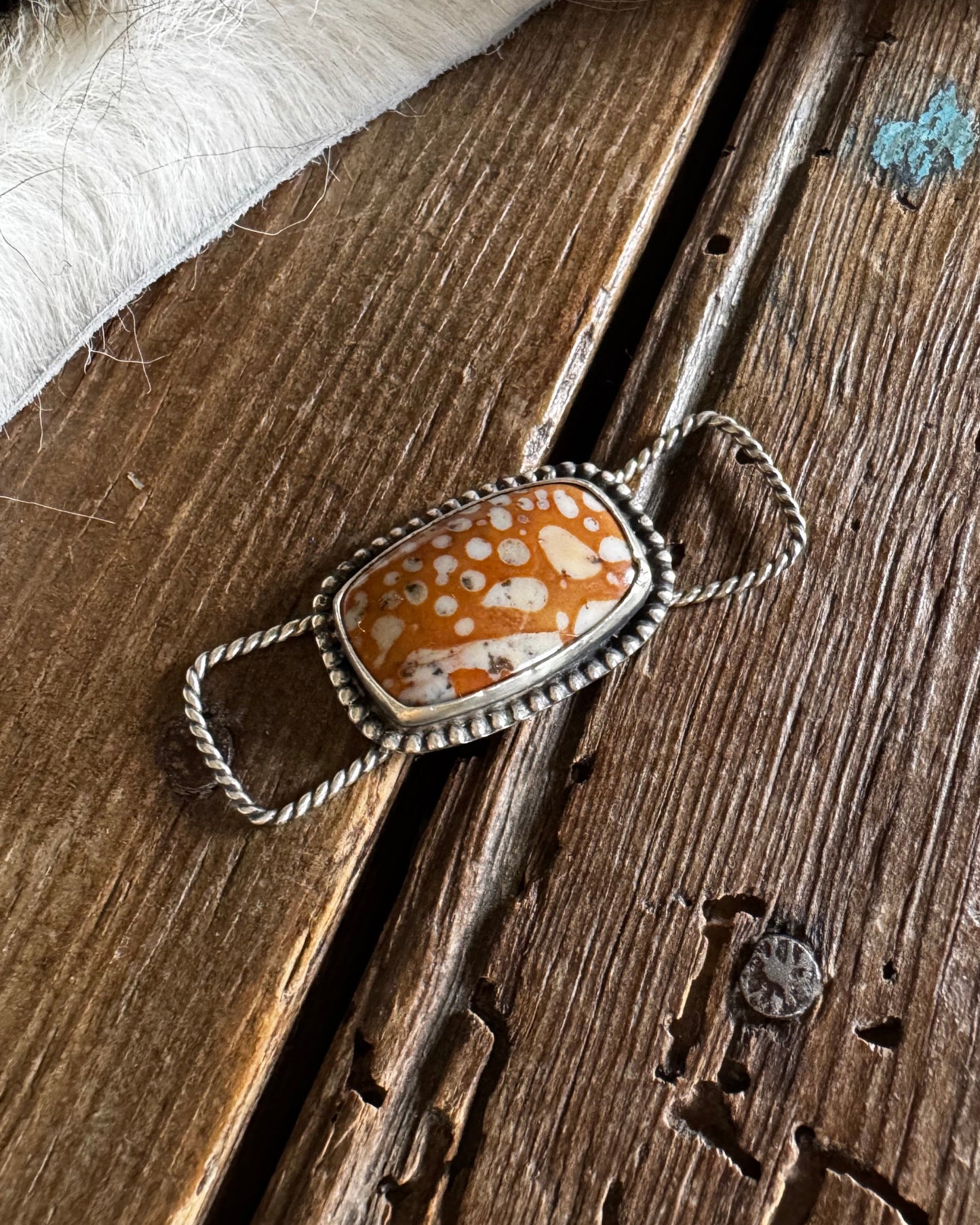 Fawn jasper twilly slide on a rustic wooden background 