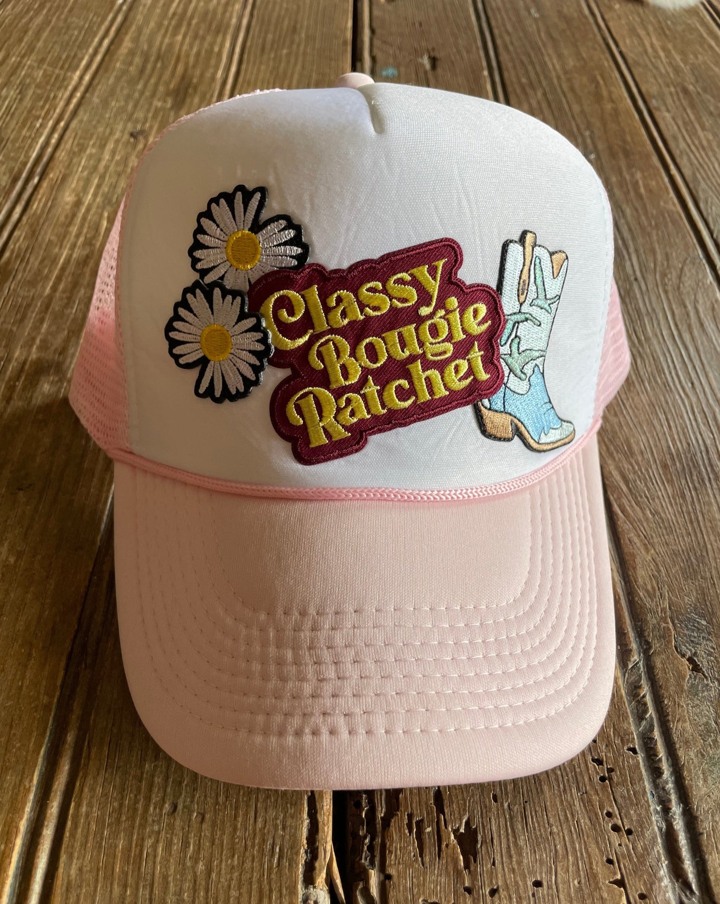 light pink/white foam trucker with patches