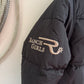 Black puffer jacket with 'Ranch Girls' logo on a white background
