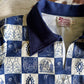 blue and white patterned with a brand tag on a brown and white shirt surface
