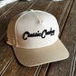 Beige cap with 'Classic Country' text on a wooden surface