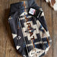 Ariat dog coat with a pattern on a wooden surface