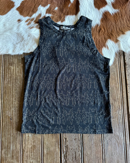 Black top on a wooden surface with a cowhide rug