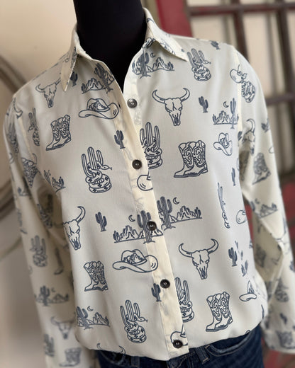 White shirt with blue western-themed pattern on a mannequin against a neutral background