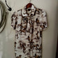 Short-sleeve shirt with horse pattern hanging on a wall