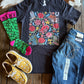 Western Rose Ranch Tee with jeans, socks and shoes on rustic wood background 
