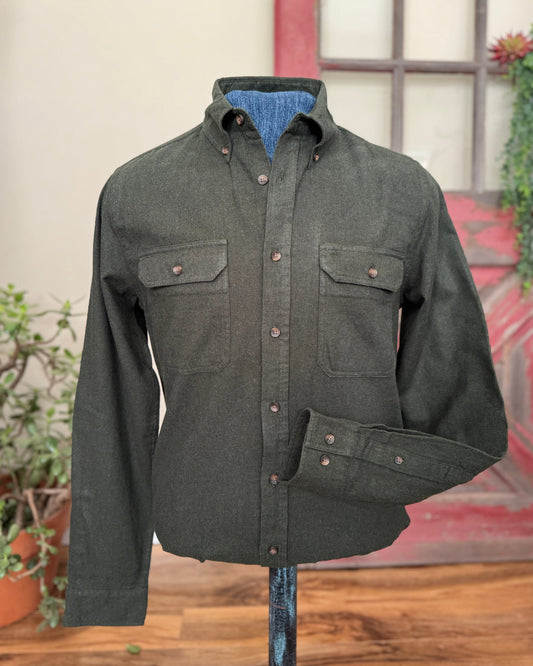 Olive green shirt on a stand against a neutral background