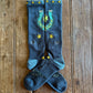 Fringe Lucky Horseshoe Performance Socks in blue showing design on rustic wood background 