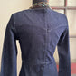 Blue denim dress on a mannequin against a neutral background