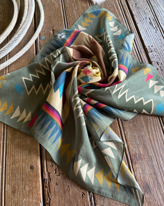 Colorful patterned scarf on a wooden surface