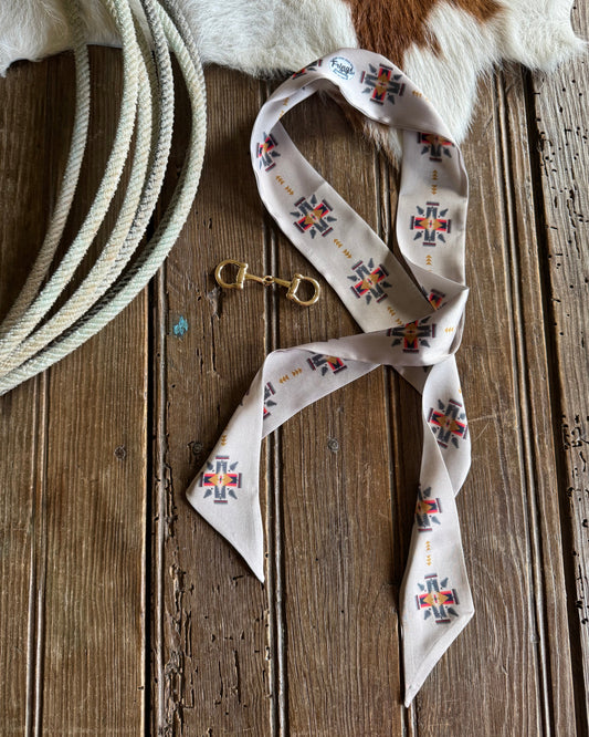 decorative bandana and rope on a wooden surface