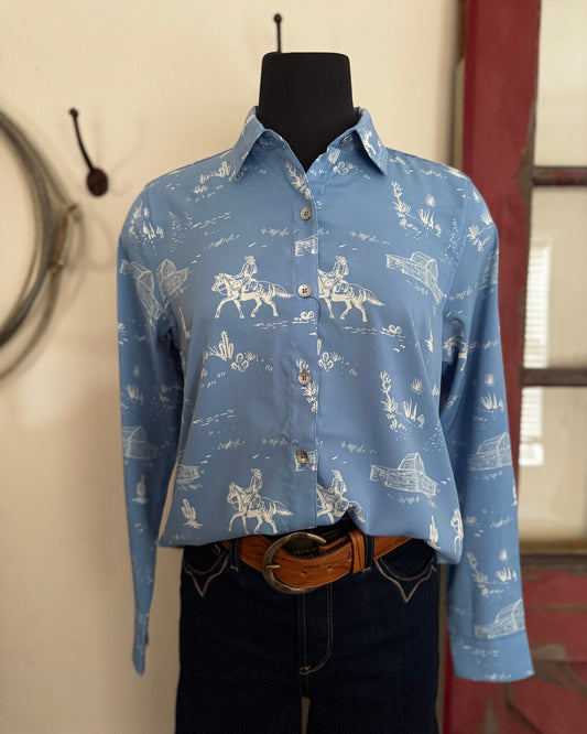 Blue shirt with white patterns on a mannequin against a neutral wall.