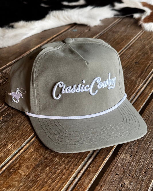 Gray cap with 'Classic Cowboy' logo on a wooden surface