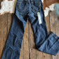 back view of Ella High Rise Slim Trouser Jeans on rustic wood background 