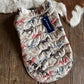 Quilted product with Ariat logo on a wooden surface
