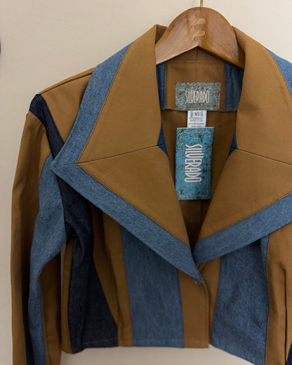 Brown and blue jacket on a hanger with a visible brand label.