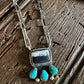 Necklace with turquoise stones on a wooden surface