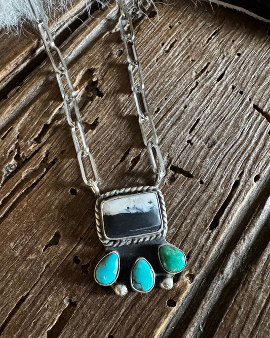 Necklace with turquoise stones on a wooden surface