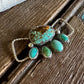 Turquoise twilly slide on a wooden surface