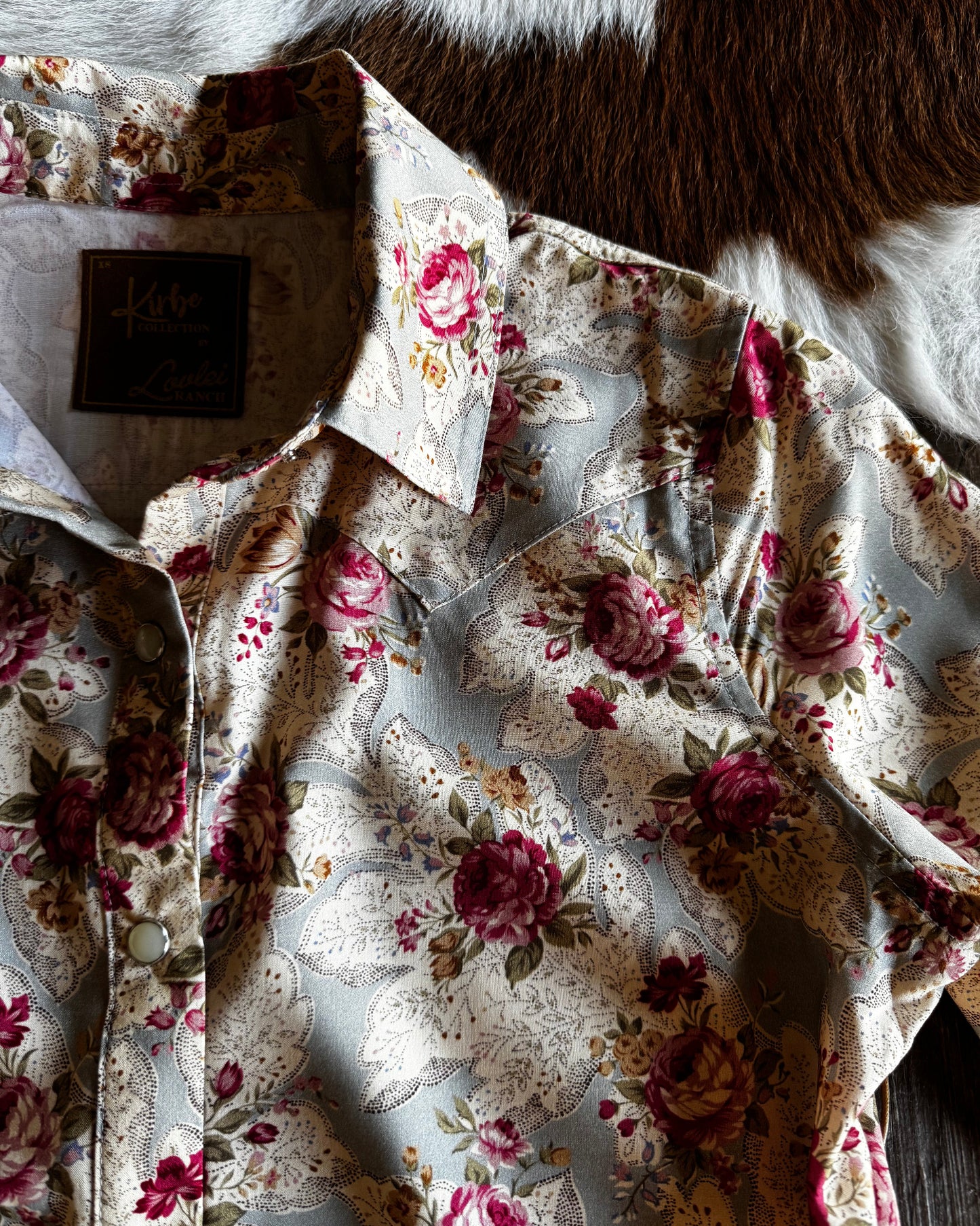 Floral-patterned fabric on a wooden surface
