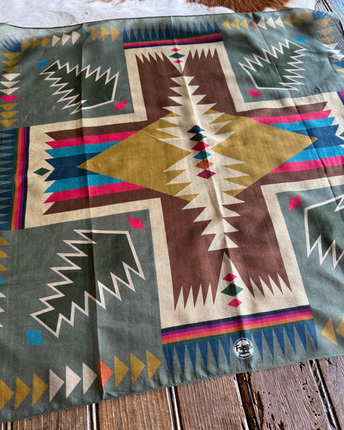 Fabric with geometric pattern on a wooden surface