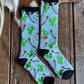 Pair of socks with a floral pattern on a wooden surface