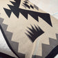 Textile with geometric pattern on a flat surface
