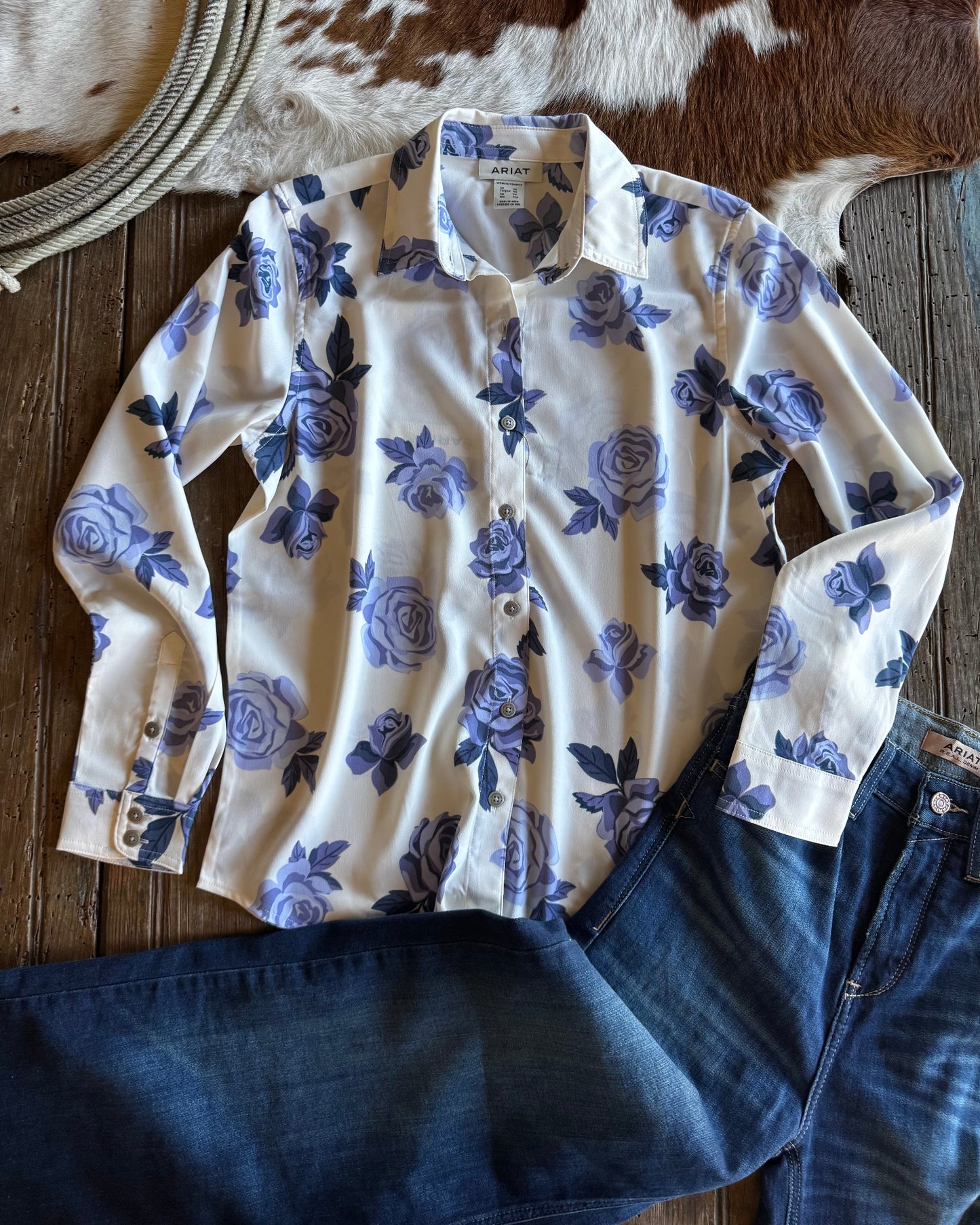White shirt with blue floral pattern on a wooden surface