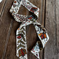 floral twilly scarf on a wooden background
