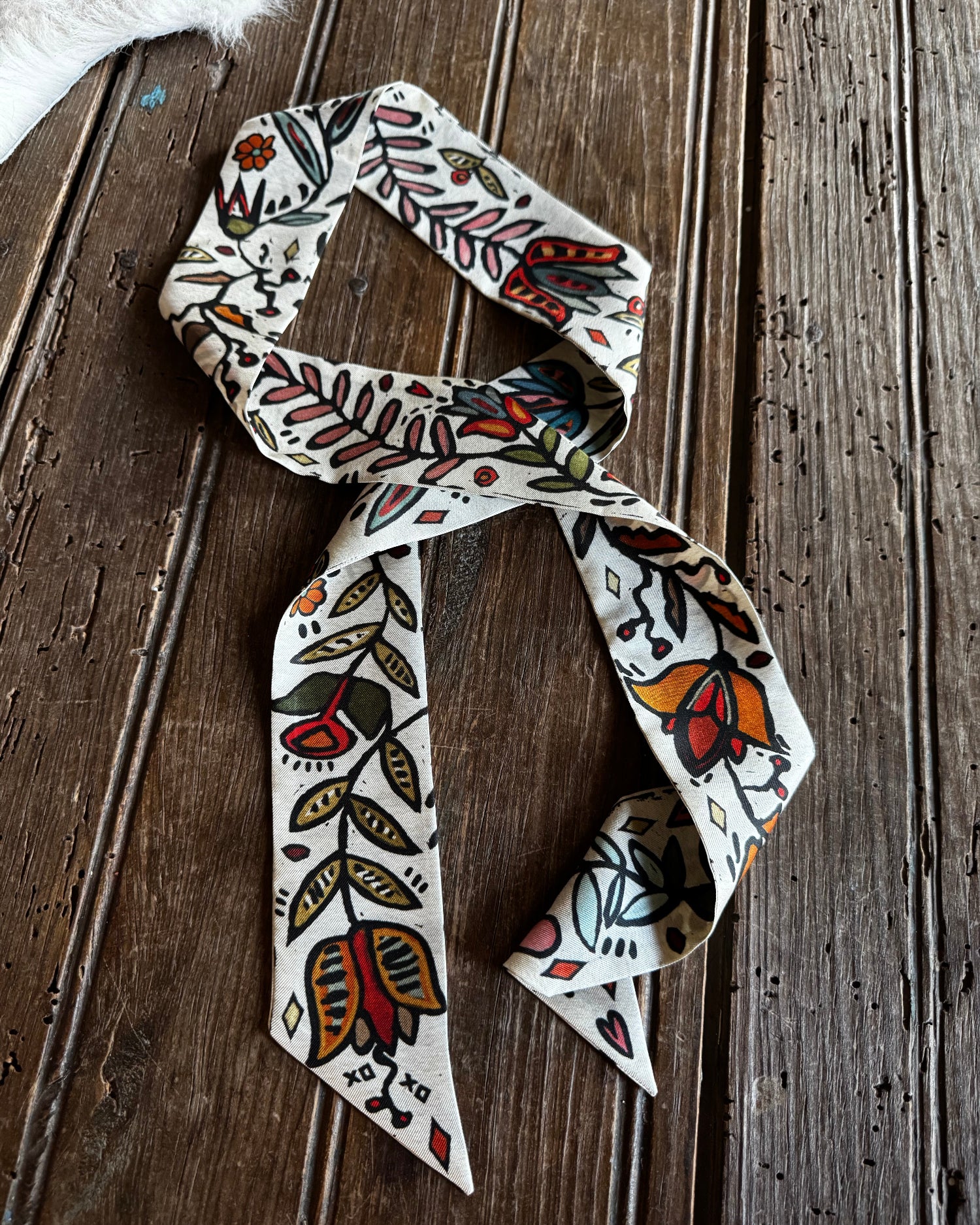 floral twilly scarf on a wooden background