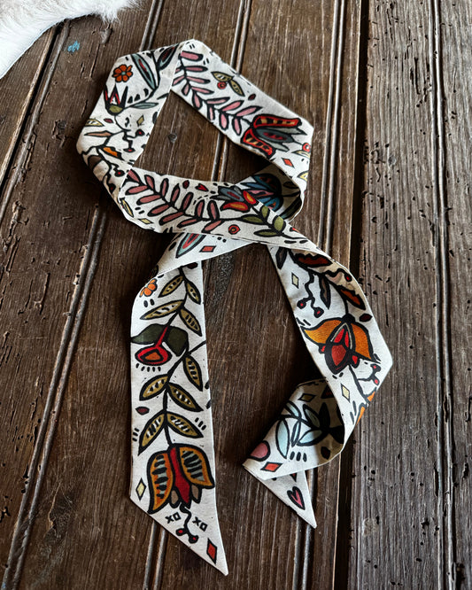 floral twilly scarf on a wooden background